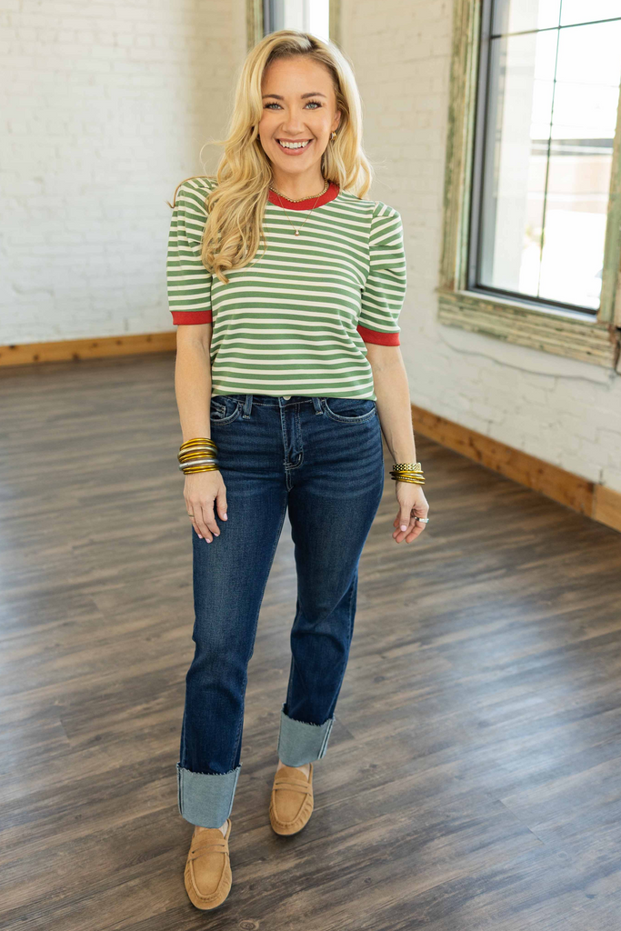 Woman wearing [LOVERET] Gracelyn High Rise Cuff Slim Straight Jeans in dark wash with 4-inch cuff