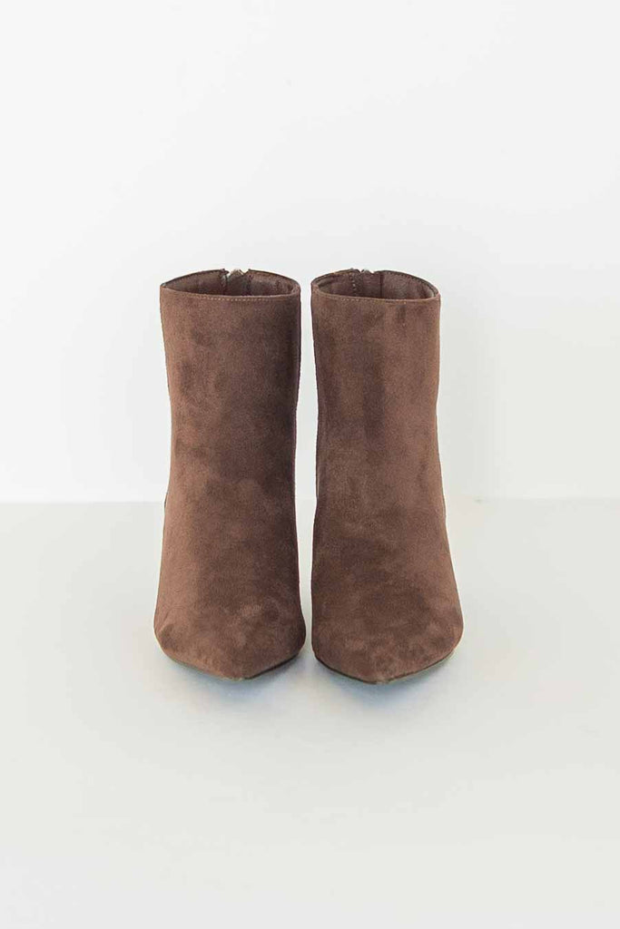 Pair of chocolate brown suede-look ankle booties with pointed toe and low kitten heel.