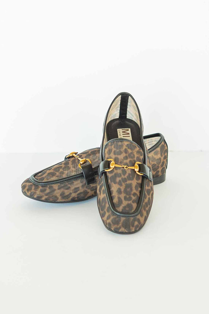 Pair of brown leopard print mesh loafers with black trim and gold horse-bit detail on a white background.
