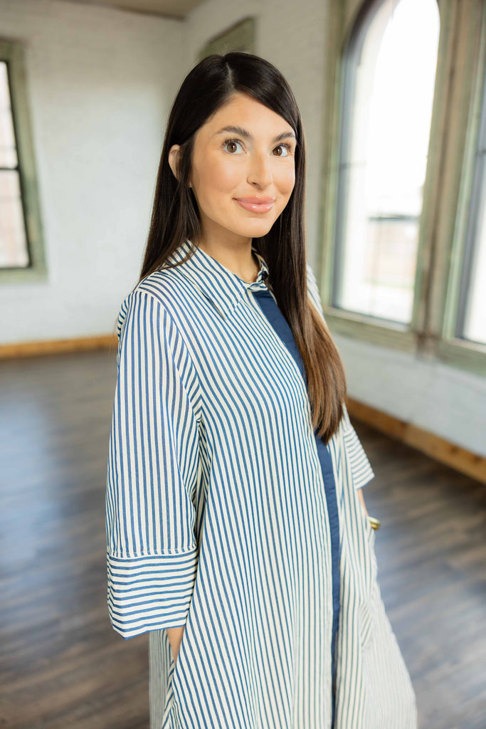  Emelia blue and white striped long sleeve caftan maxi dress with navy contrast placket and sneakers 