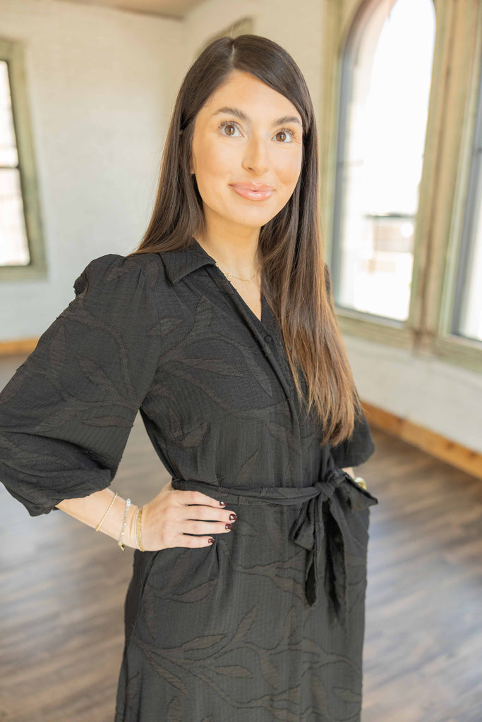 wearing the black Lily textured 3/4 sleeve button front midi dress with waist tie belt and floral loafers