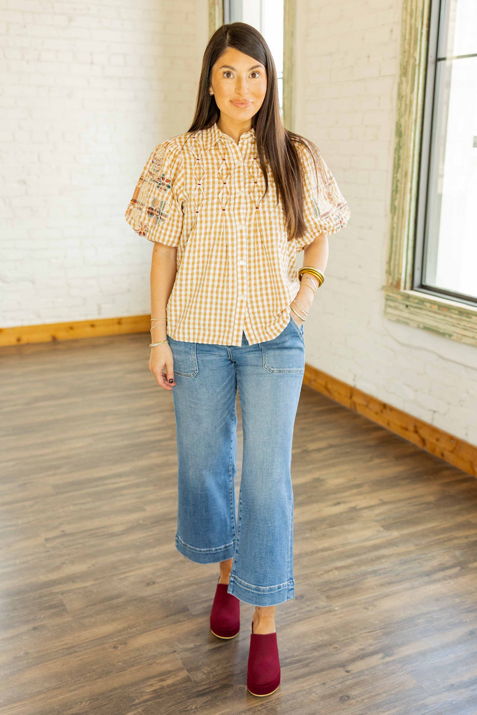 Kayla wearing the Lovervet Serenity medium wash crop wide leg jeans with utility pockets and burgundy clogs 