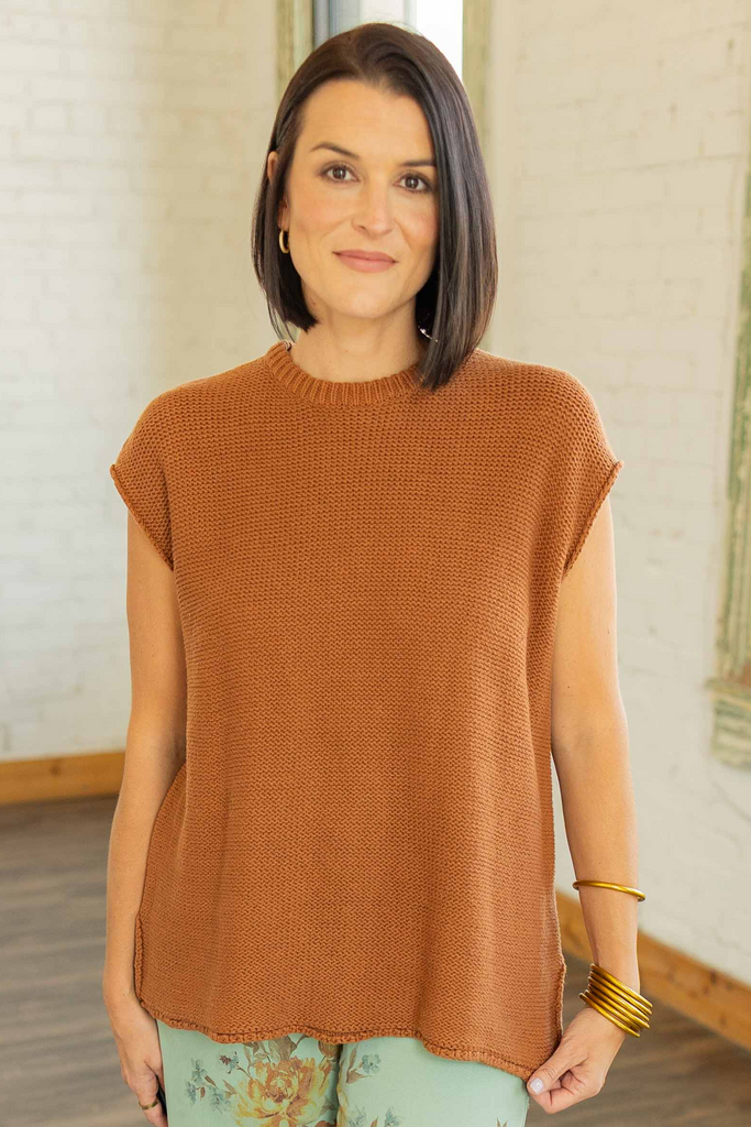 Kandace wearing the Eloise cap sleeve knit sweater top in caramel brown with a relaxed fit, styled with mint floral pants